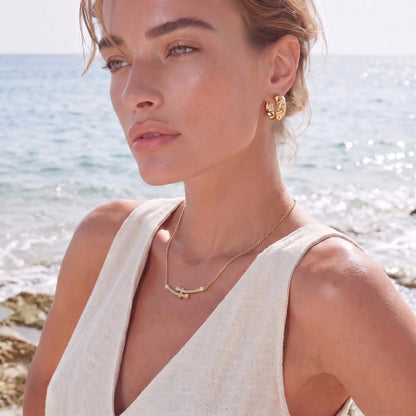 Bamboo Crystal Arc Necklace by Aurora Beauty